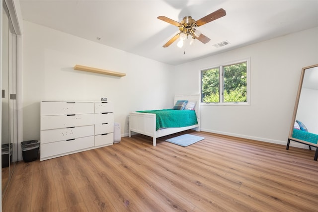 unfurnished bedroom with light hardwood / wood-style flooring and ceiling fan