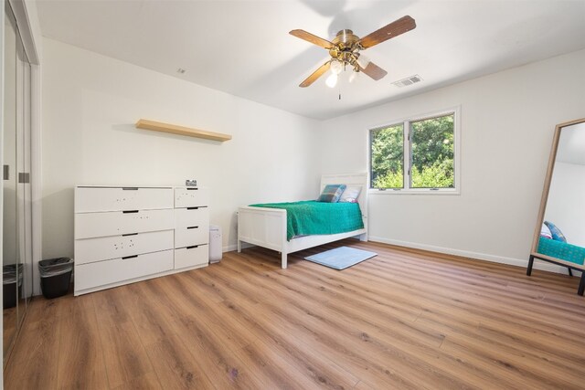 9000 Bear Creek Dr, Austin, TX 78737 - bedroom with light wood-type flooring, baseboards, and a ceiling fan