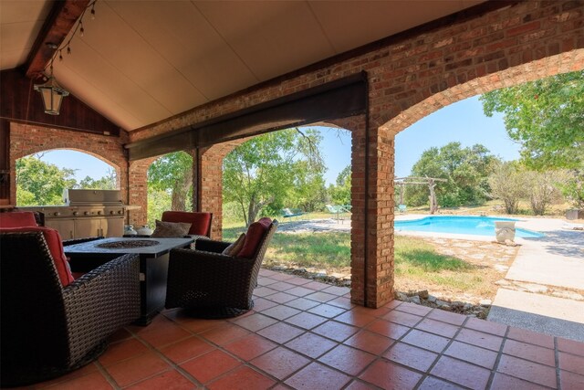 view of patio featuring exterior kitchen