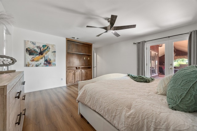 bedroom with dark hardwood / wood-style floors, access to exterior, ceiling fan, and french doors