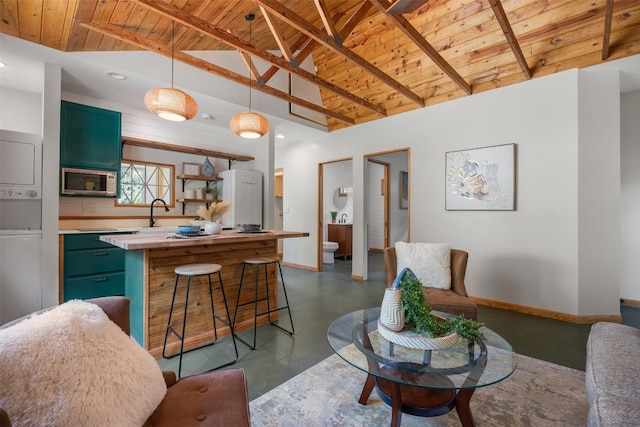 living room with beam ceiling, wood ceiling, and high vaulted ceiling