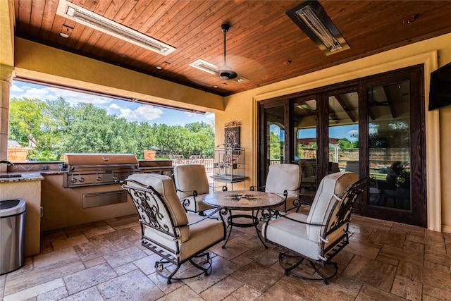 view of patio with grilling area and an outdoor kitchen