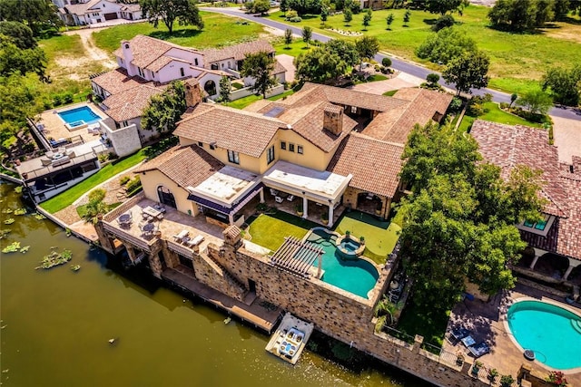 birds eye view of property featuring a residential view and a water view