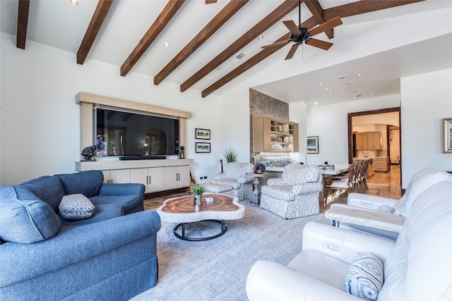 living room with ceiling fan, lofted ceiling with beams, and carpet floors