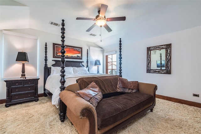 carpeted bedroom with ceiling fan and vaulted ceiling