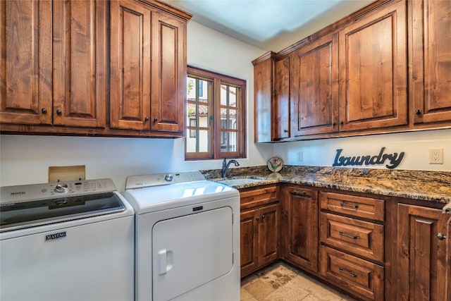 washroom featuring washer and clothes dryer, sink, light tile patterned floors, and cabinets