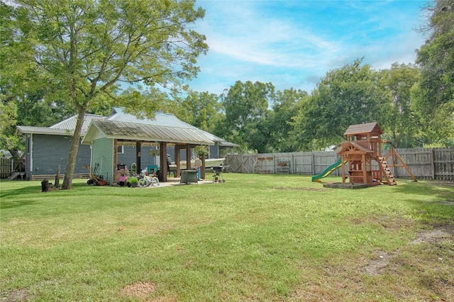 view of yard with a playground, a fenced backyard, and a gazebo