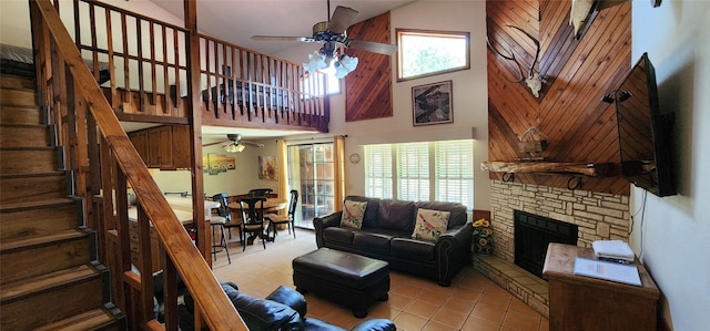 tiled living room featuring high vaulted ceiling, plenty of natural light, and ceiling fan