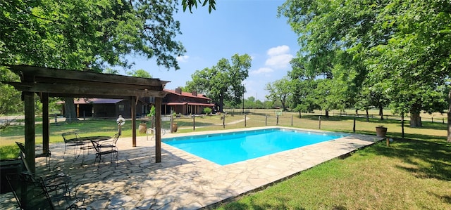 view of pool featuring a lawn, a patio area, and a pergola