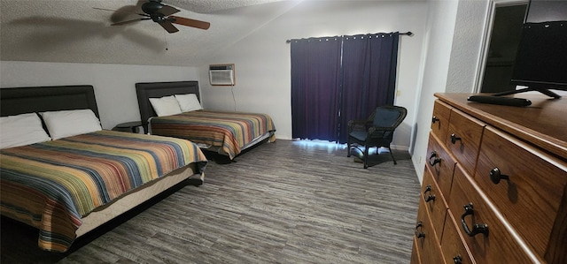 bedroom featuring a textured ceiling, hardwood / wood-style floors, ceiling fan, lofted ceiling, and a wall unit AC