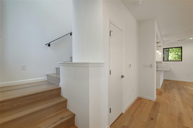 stairway with wood-type flooring