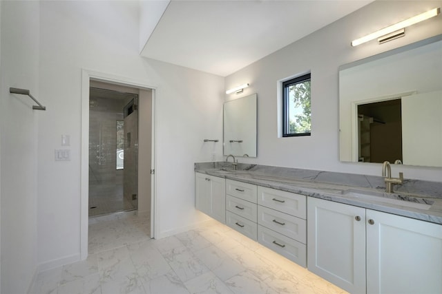 bathroom featuring walk in shower, tile patterned floors, and dual vanity