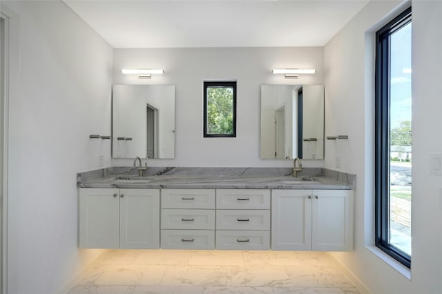 bathroom featuring double vanity