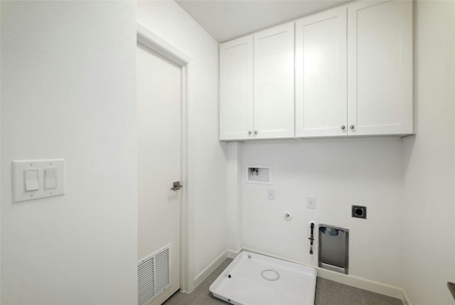 laundry area with hookup for a washing machine, gas dryer hookup, electric dryer hookup, and cabinets