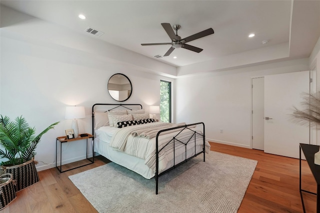 bedroom featuring ceiling fan and light hardwood / wood-style floors