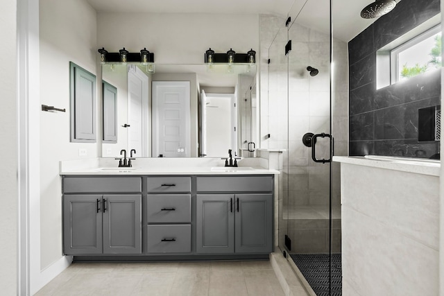 bathroom featuring vanity, an enclosed shower, and tile patterned floors