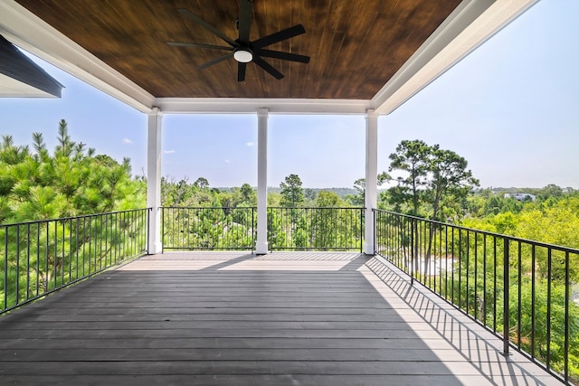 wooden deck featuring ceiling fan