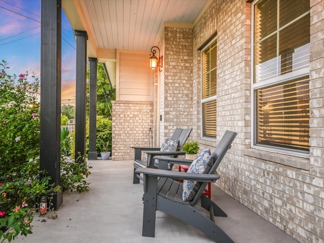 view of patio terrace at dusk