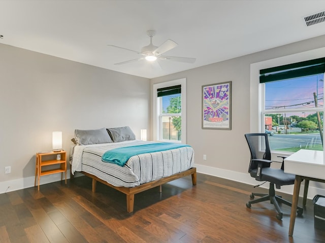 bedroom featuring dark hardwood / wood-style flooring and ceiling fan