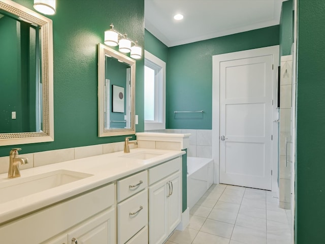 bathroom featuring tile patterned flooring, vanity, and a tub to relax in