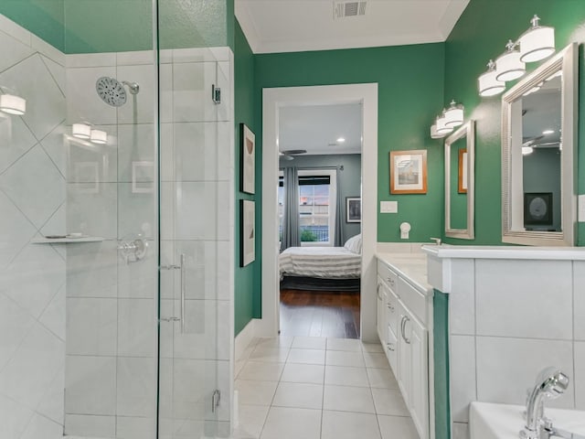 bathroom with tile patterned floors, vanity, and separate shower and tub