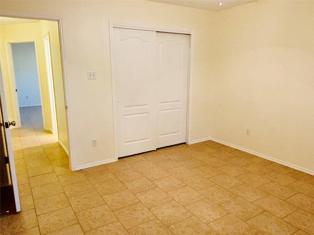 unfurnished bedroom featuring a closet