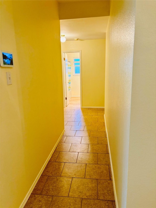 hallway featuring tile patterned floors