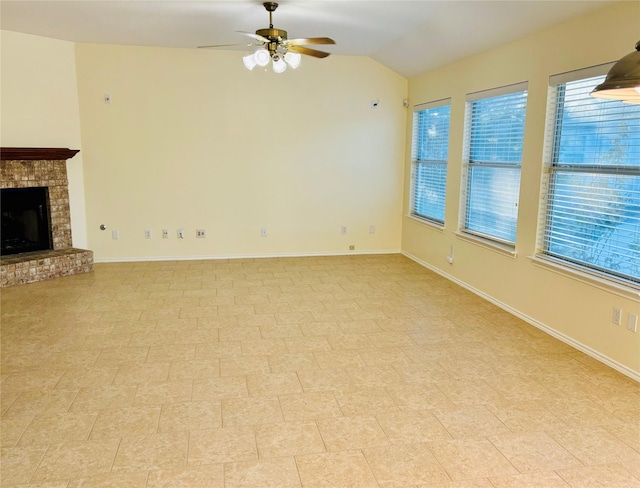 unfurnished living room featuring ceiling fan, lofted ceiling, and a fireplace