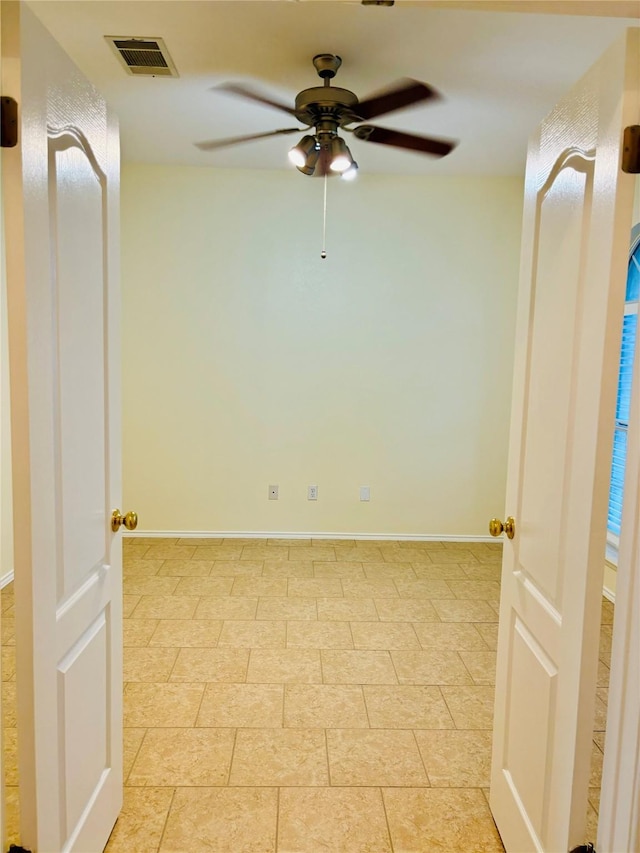 unfurnished room featuring ceiling fan