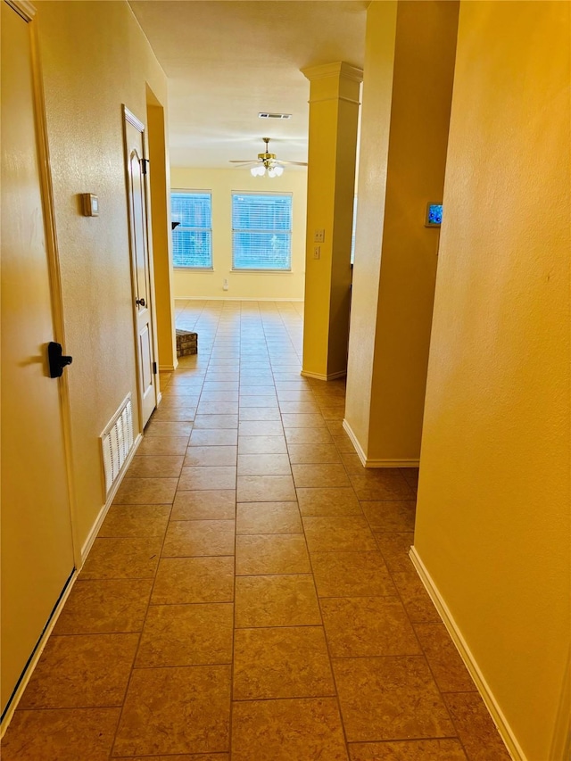 corridor with tile patterned flooring