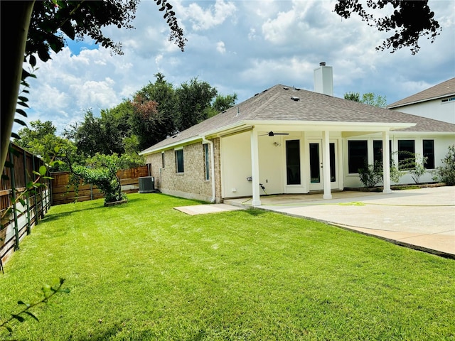 back of house featuring a patio, central AC, ceiling fan, and a lawn