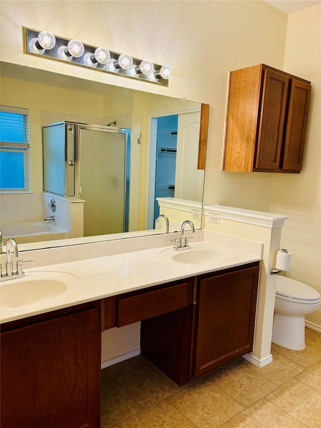 full bathroom featuring shower with separate bathtub, vanity, and toilet