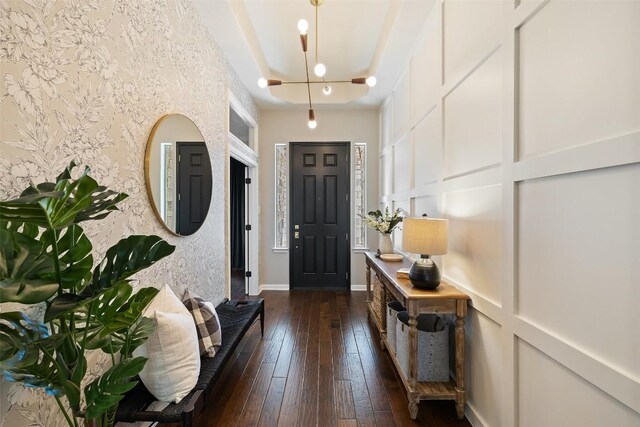 foyer entrance with dark hardwood / wood-style flooring