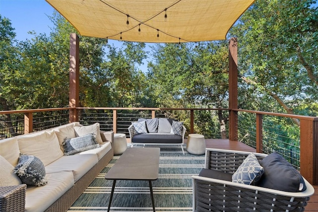 wooden terrace with an outdoor hangout area