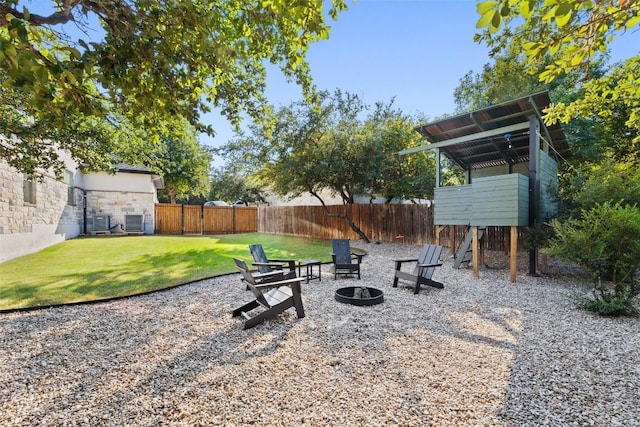 view of yard with a fire pit