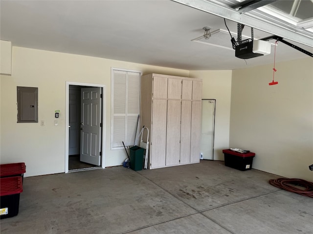 garage featuring electric panel and a garage door opener