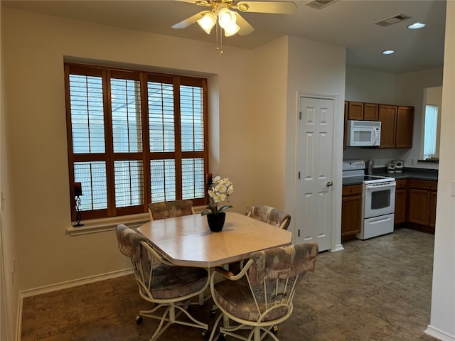 dining room with ceiling fan