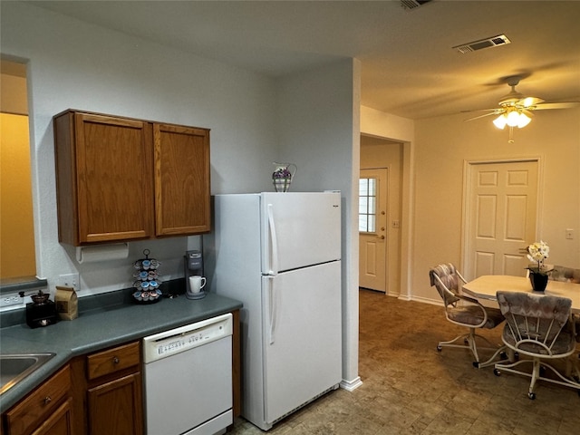 kitchen with white appliances and ceiling fan