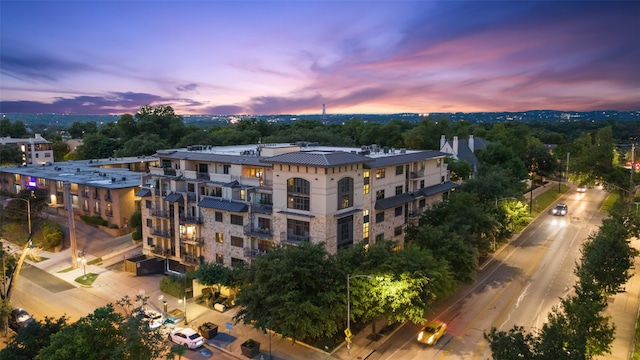 view of outdoor building at dusk