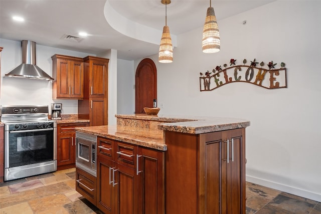 kitchen featuring pendant lighting, stainless steel appliances, a center island, light stone countertops, and wall chimney exhaust hood