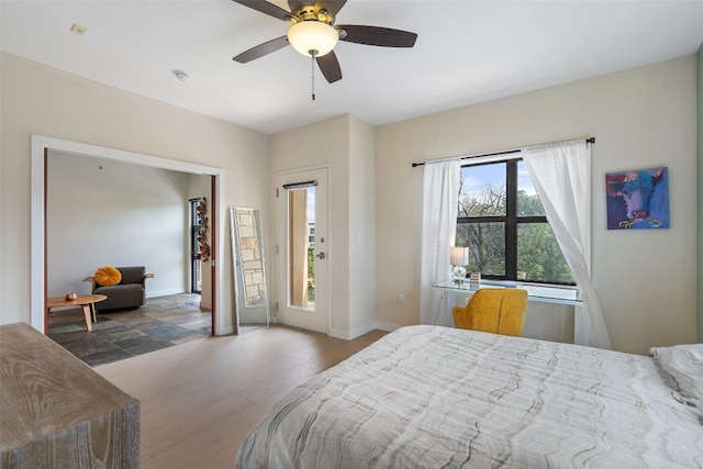 bedroom with ceiling fan and hardwood / wood-style flooring