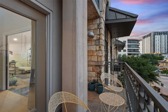 view of balcony at dusk