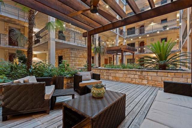 deck featuring an outdoor hangout area and ceiling fan