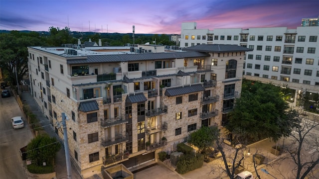 view of outdoor building at dusk