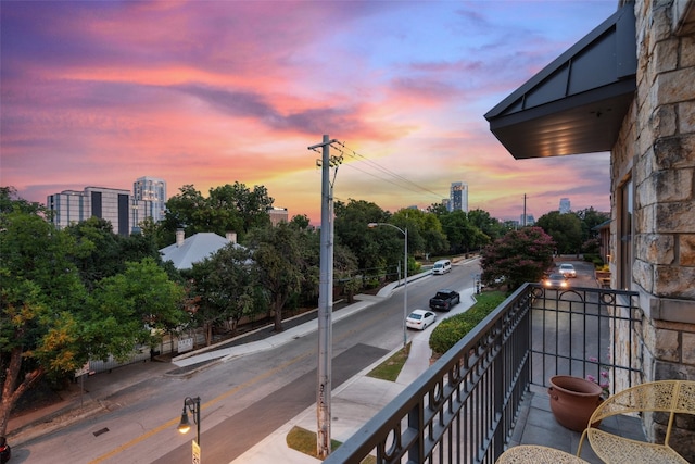 view of balcony at dusk