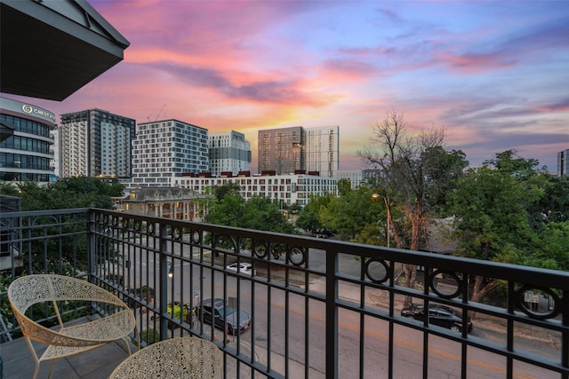 view of balcony at dusk