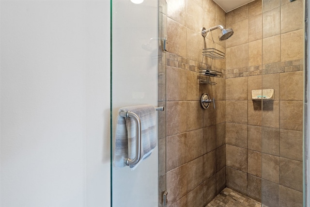 bathroom featuring an enclosed shower