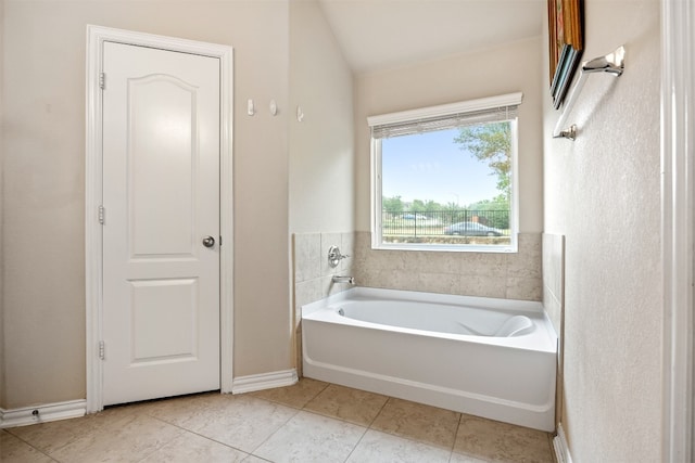 bathroom featuring a bathtub and tile patterned flooring