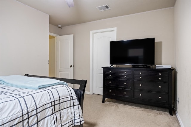 bedroom featuring ceiling fan and light colored carpet