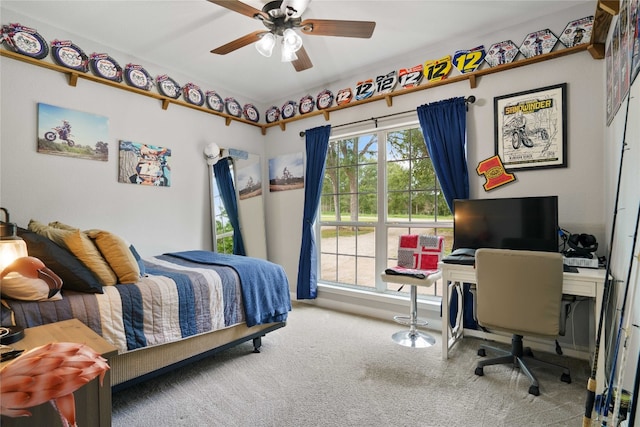 carpeted bedroom with ceiling fan and multiple windows